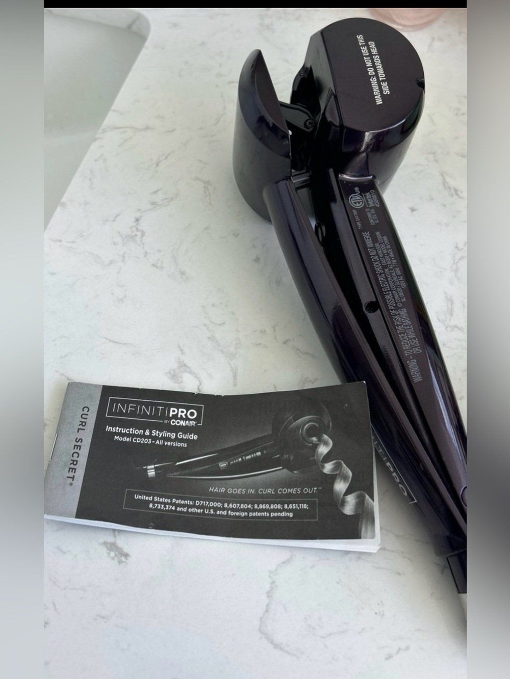Conair InfinitiPRO Curl Secret automatic hair styler.